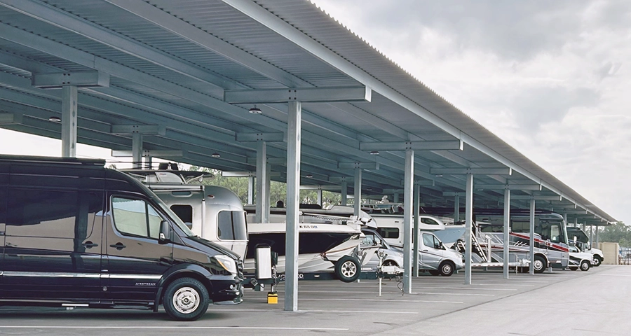 John Fayard Self Storage Rv and Boat storage covered parking spots full of cars, vans, boats, and rvs